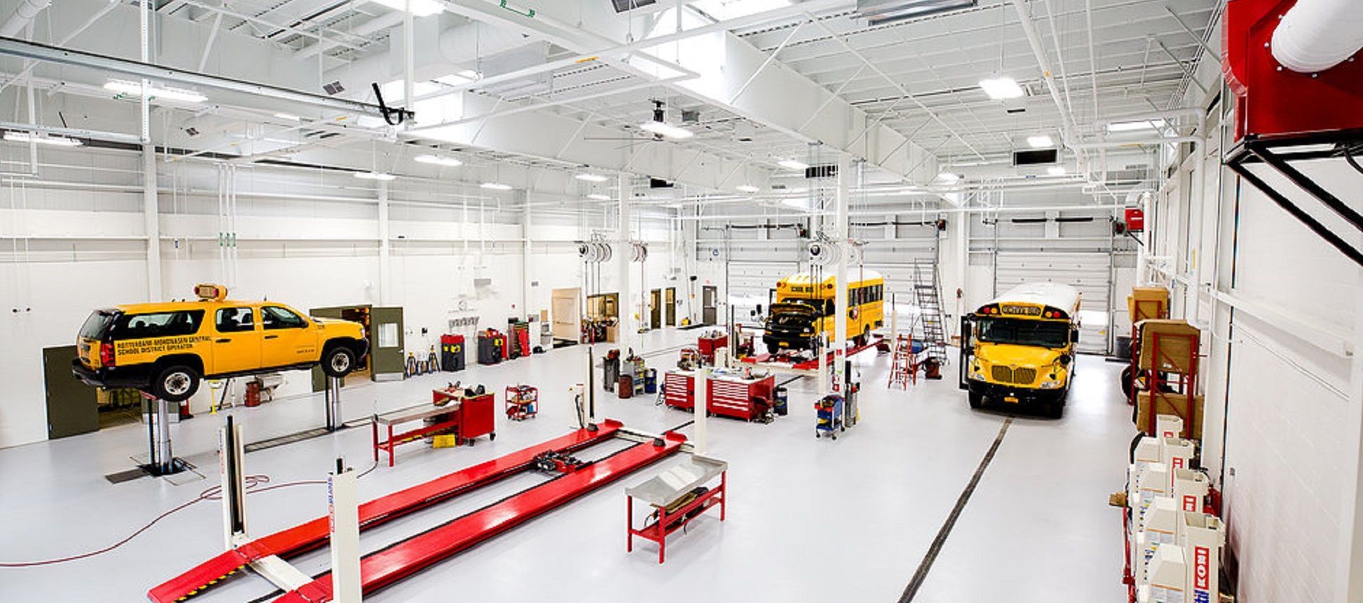 This fresh new school maintenance facility is outfitted with Stertil-Koni DIAMONDLIFTs, platform SKYLIFTs and Mobile Column Lifts