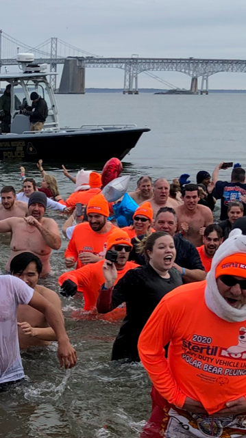 Stertil-Koni plungers, in glowing orange attire, helped brighten spirits for Special Olympics of Maryland